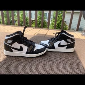 Nike womens Jordan 1 black and white mids